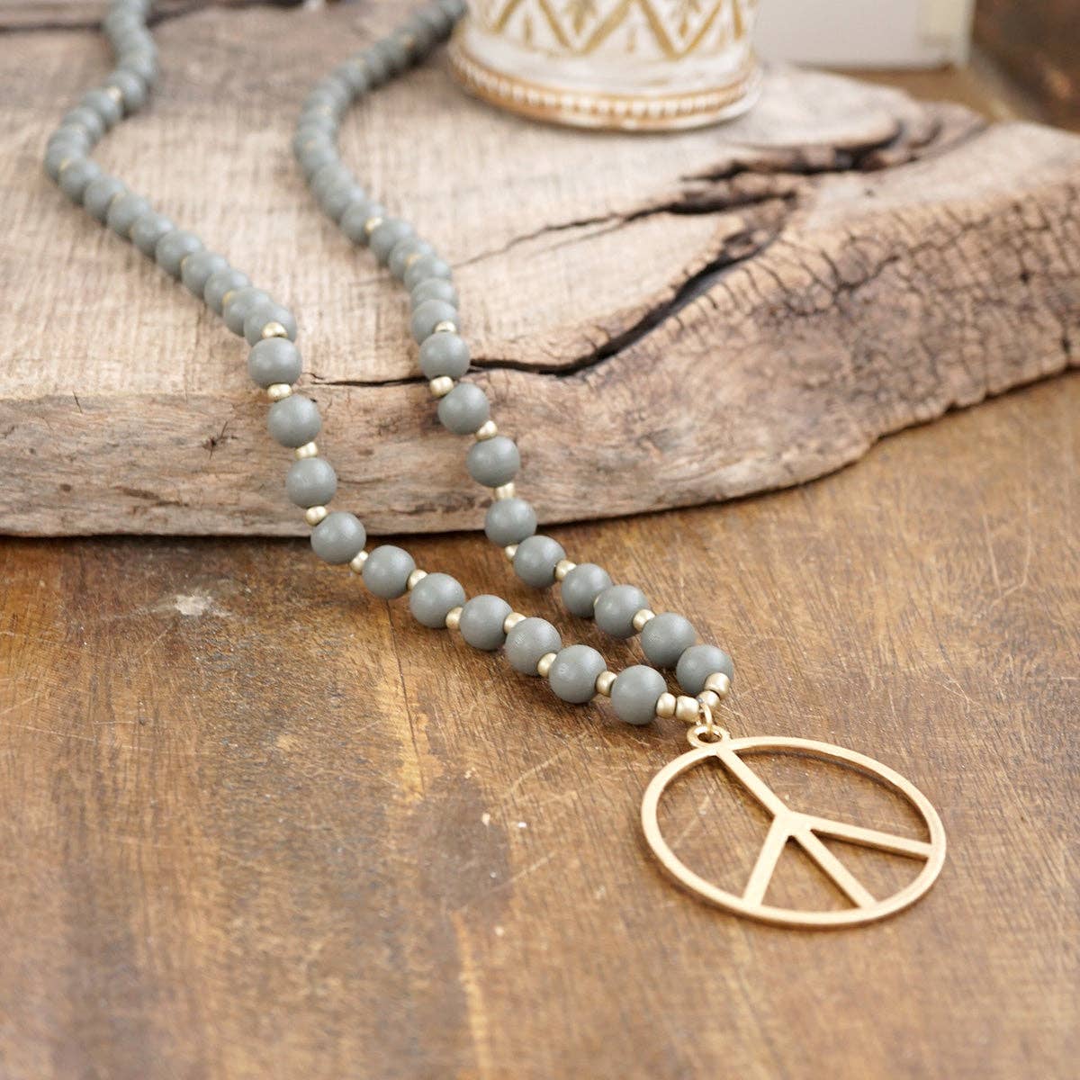 Long Wood Bead Necklace with golden peace sign pendant - Gray